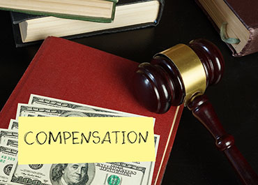 Employee pay for exit searches—legal concept with gavel, cash, and law books.