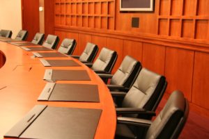 Executive meeting room—legal protection for whistleblowers facing retaliation.